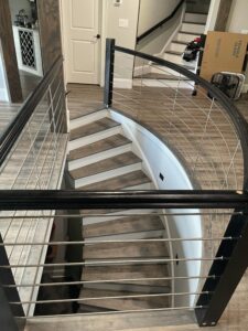Curved stainless cable railing detail, custom residential
